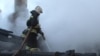 Tajikistan/Russia -- Russian fireman battle with a fire at house near Moscow,while five tajik migrant death, 5 January 2014